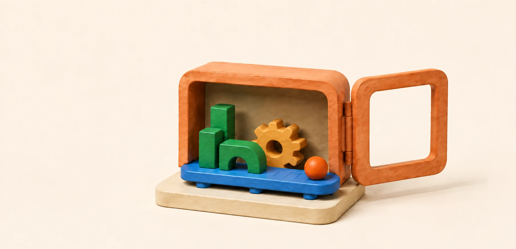 An open apricot clay workshop reveals green building blocks, a yellow cog and a blue track.